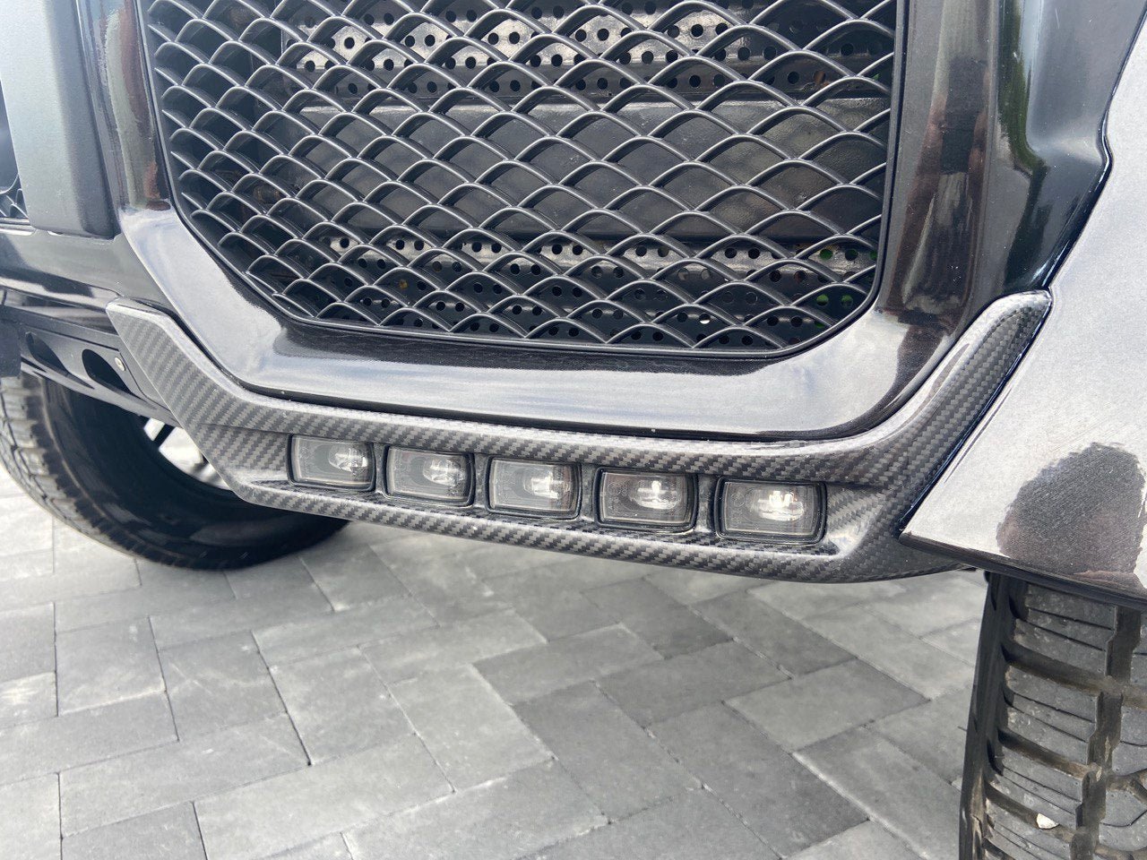 4x4 Squared carbon front AMG bumper lip spoiler with original LEDs for Mercedes W463 G Wagon.