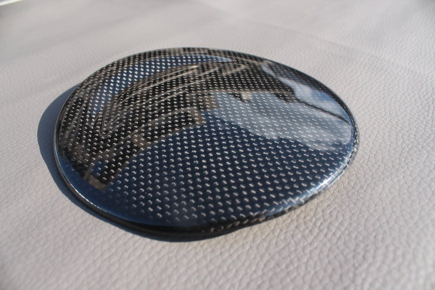 Carbon fiber fuel cap cover for Ferrari 488 GTB 2015-2017 from Tuning Shop, featuring high-quality carbon construction and a sleek finish.