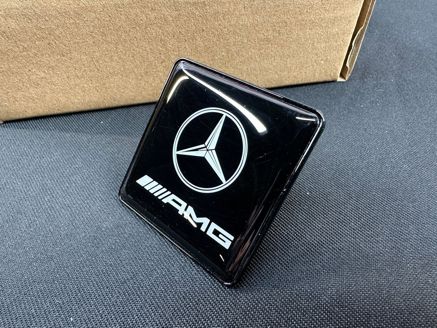 Seats Emblem set in black color with AMG Mercedes-Benz logo