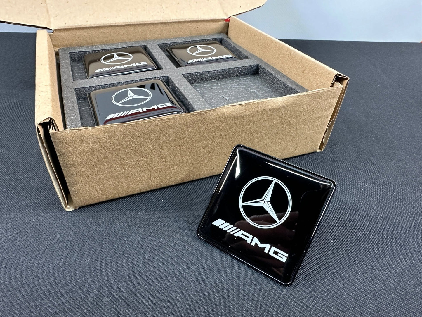 Seats Emblem set in black color with AMG Mercedes-Benz logo