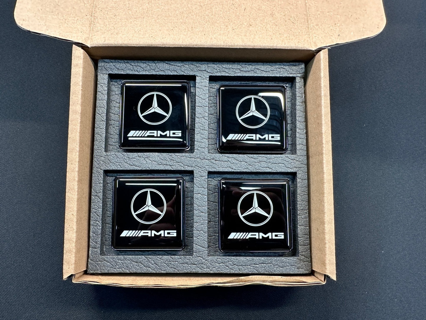 Seats Emblem set in black color with AMG Mercedes-Benz logo