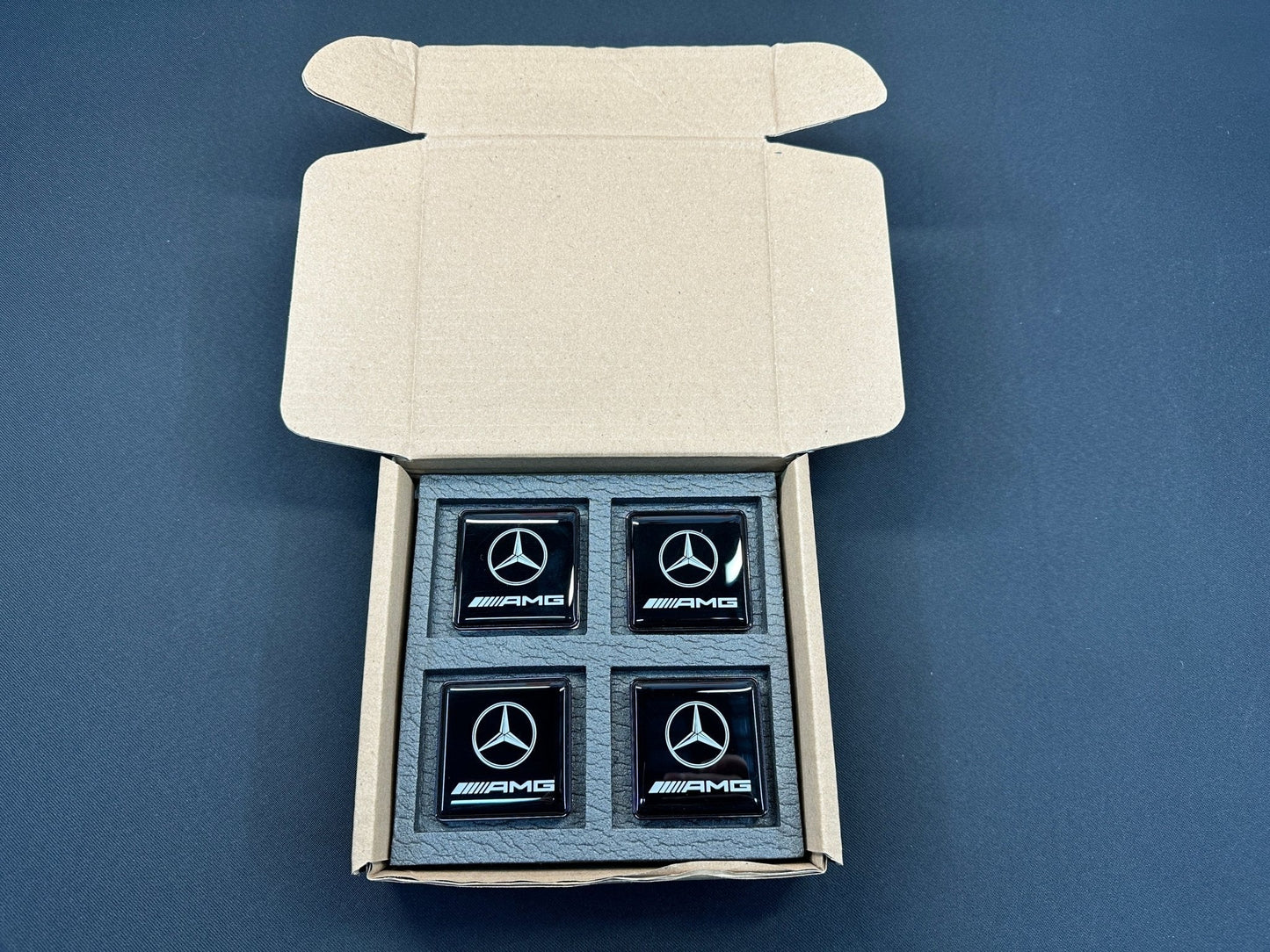 Seats Emblem set in black color with AMG Mercedes-Benz logo