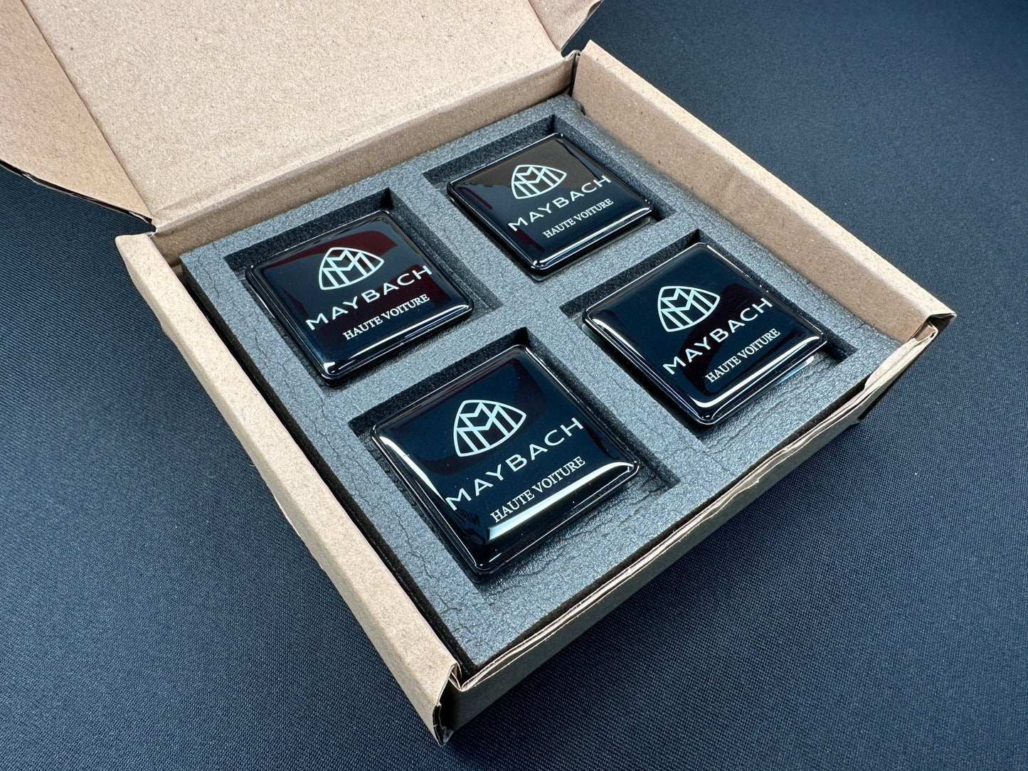 Seats Emblem set in black color with Maybach Haute Voiture logo for Mercedes-Benz