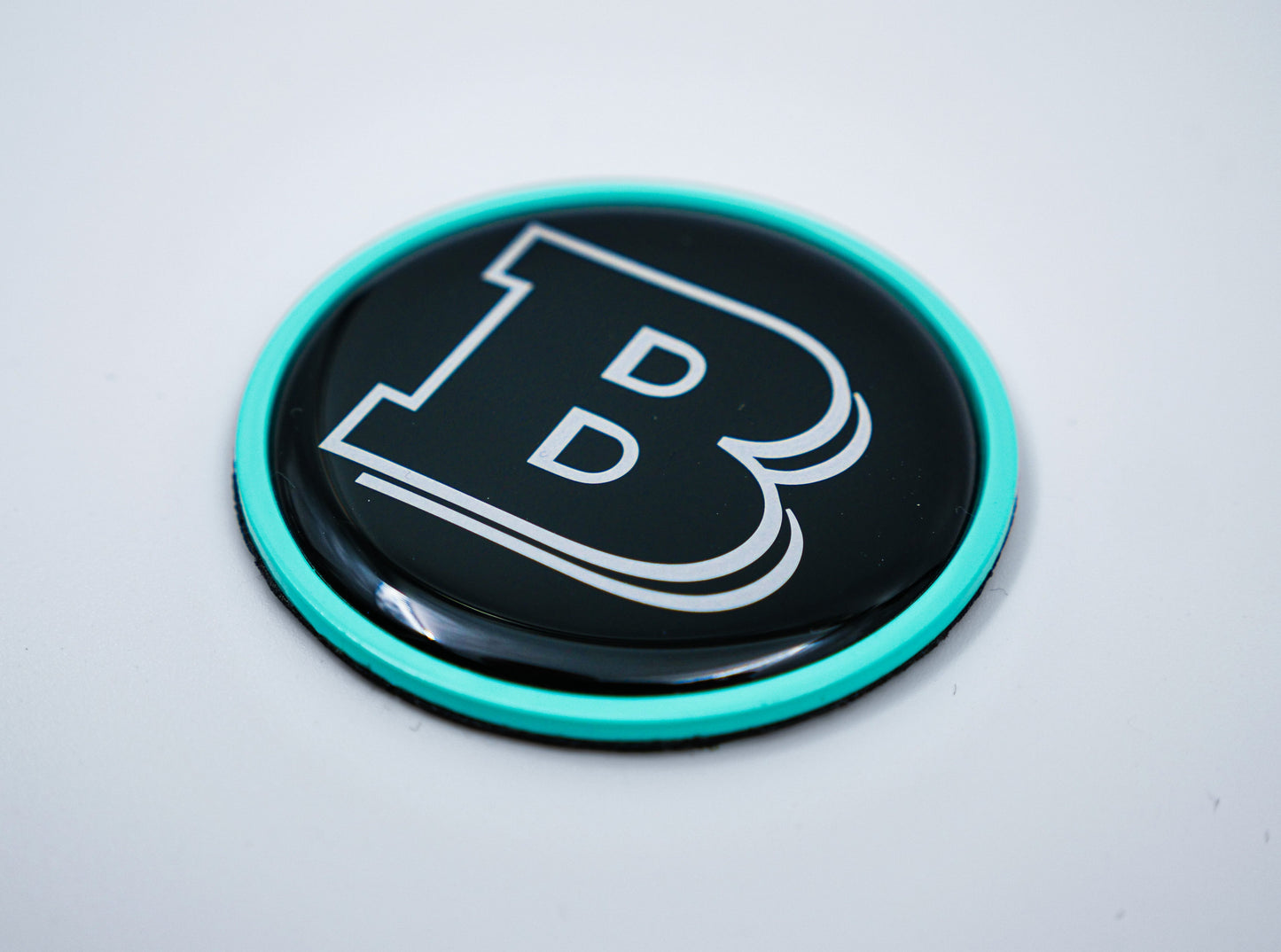 2-component metal Tiffany blue Brabus badge logo emblem 55mm for hood scoop of Mercedes-Benz W463, W463A, W464 G-Class.