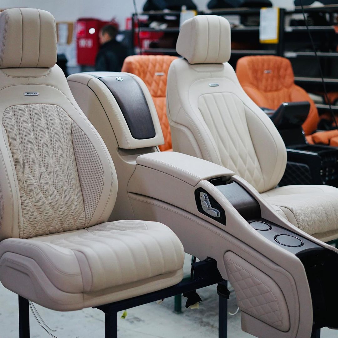 Separate multicontour rear seats with central multifunctional panel for Mercedes-Benz W463A W464 from Tuning Shop, available in various colors and finishes.