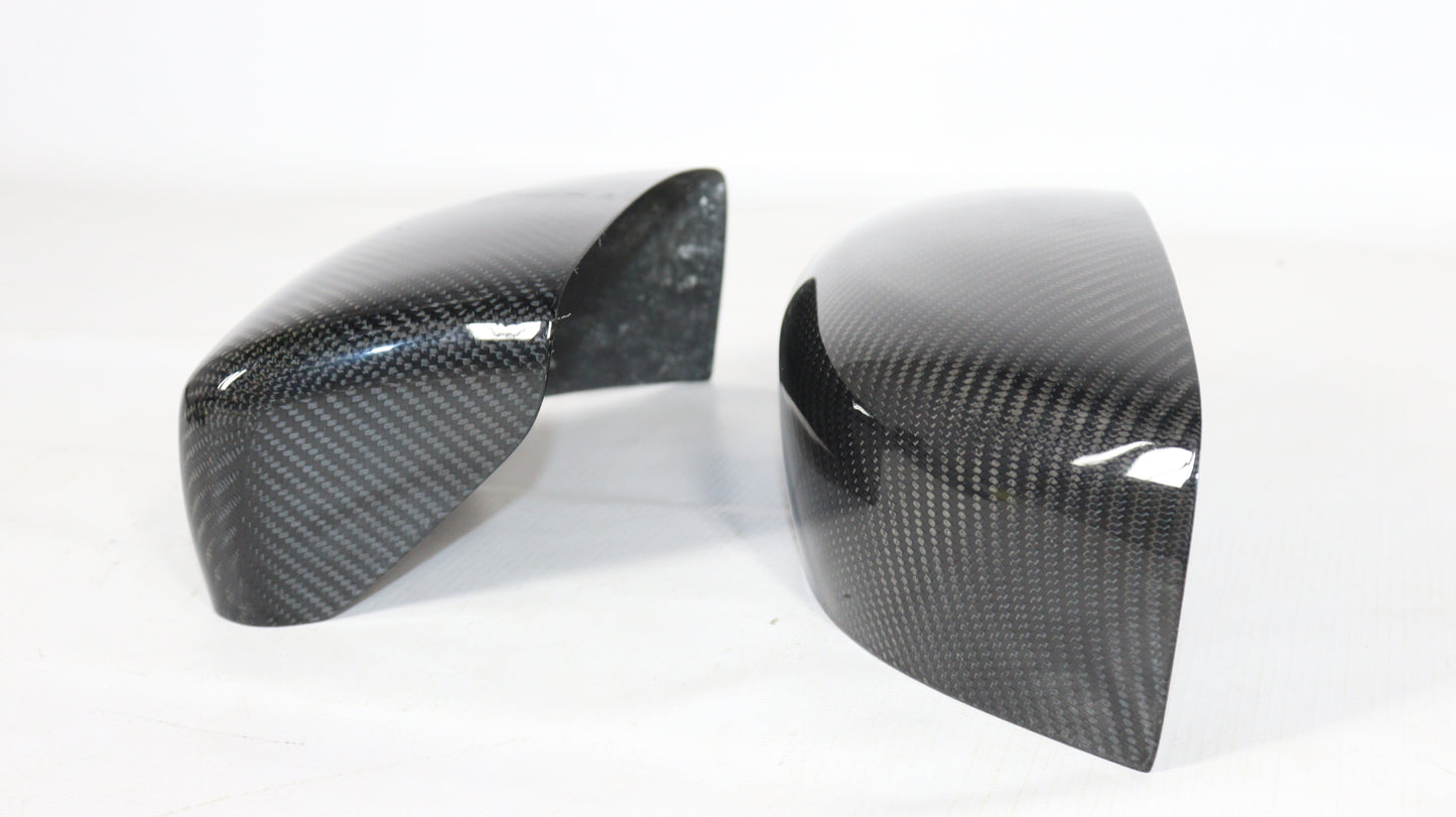 Carbon mirror covers for Maserati Quattroporte Ghibli 2013+ from Tuning Shop, featuring genuine carbon fiber with a high-gloss UV-resistant coating.