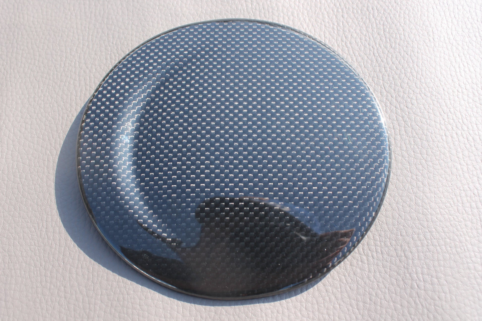 Carbon fiber fuel cap cover for Ferrari 488 GTB 2015-2017 from Tuning Shop, featuring high-quality carbon construction and a sleek finish.