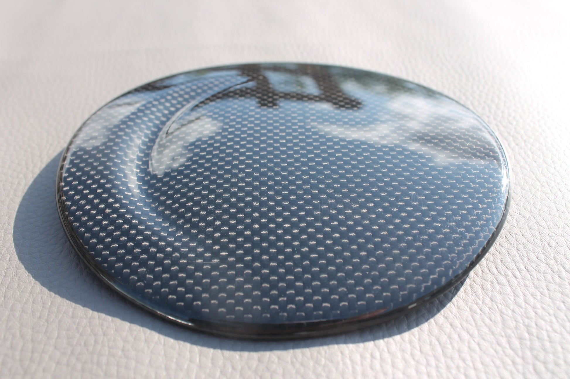 Carbon fiber fuel cap cover for Ferrari 488 GTB 2015-2017 from Tuning Shop, featuring high-quality carbon construction and a sleek finish.