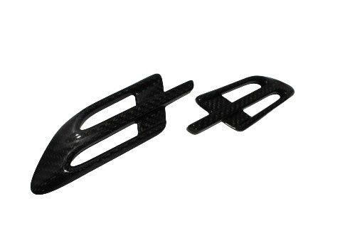 Side vents covers 2-piece set for Bentley Bentayga 2015-2018, made from genuine carbon fiber with a grey high-gloss finish.