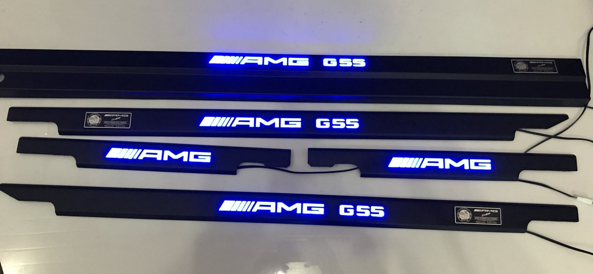 AMG G55 LED Illuminated Door Sills 4 or 5 pcs for Mercedes-Benz G-Class W463 from Tuning Shop, featuring stainless steel construction and LED illumination.