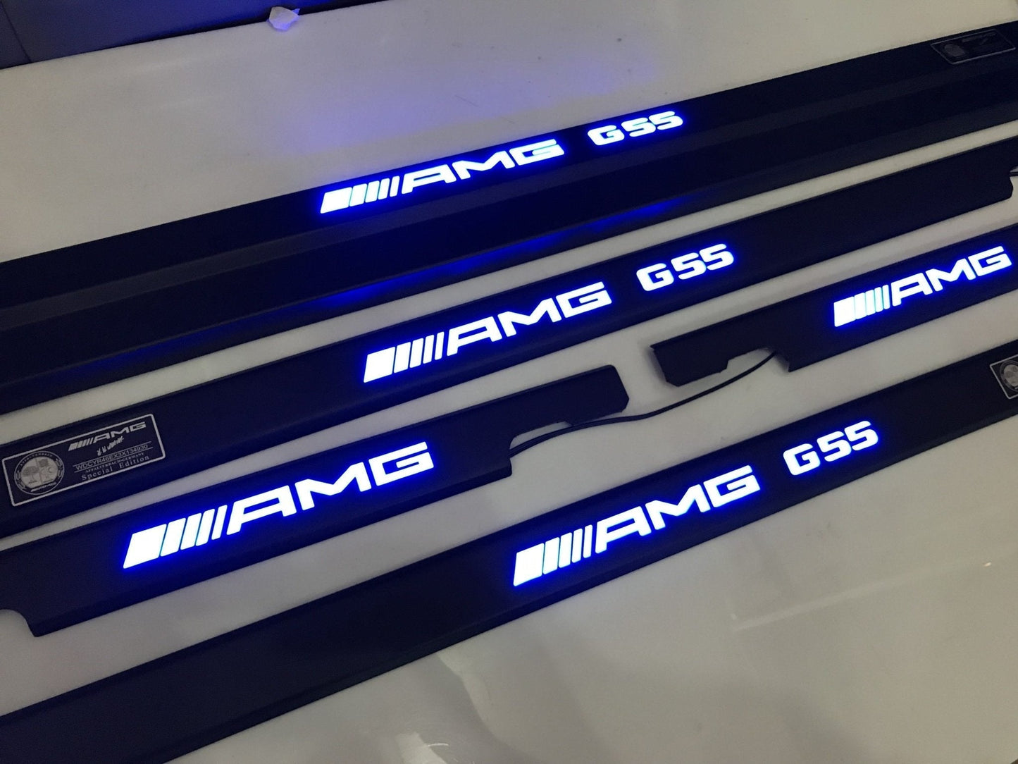 AMG G55 LED Illuminated Door Sills 4 or 5 pcs for Mercedes-Benz G-Class W463 from Tuning Shop, featuring stainless steel construction and LED illumination.