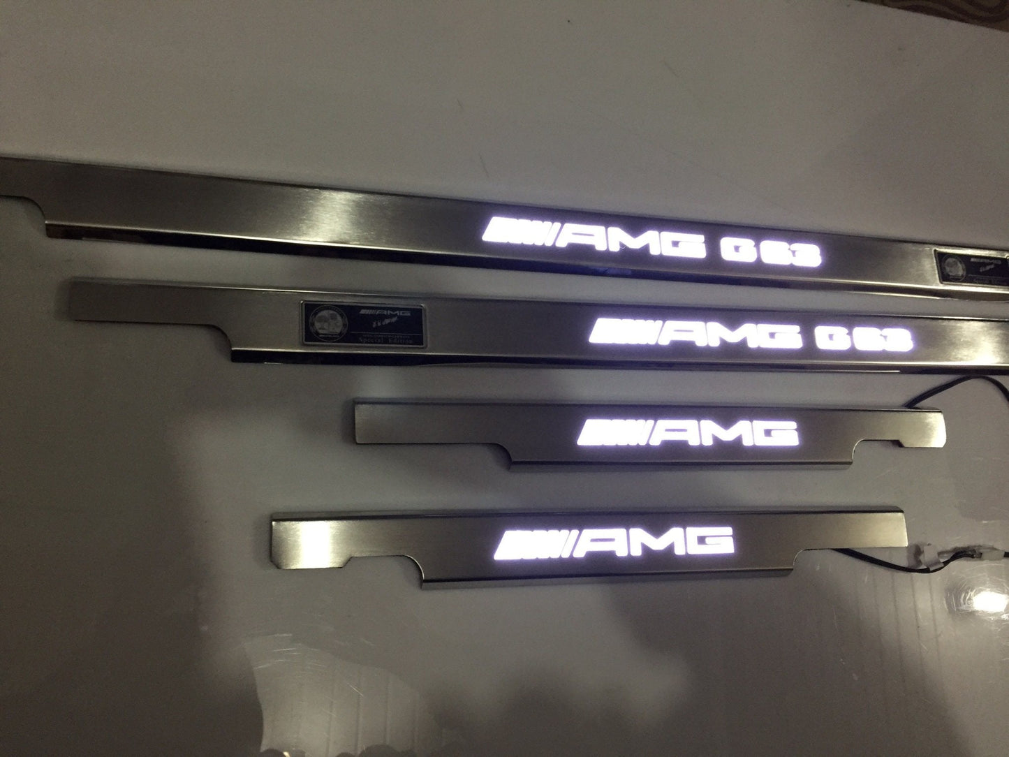 AMG G63 LED Illuminated Door Sills 4 or 5 pcs for Mercedes-Benz G-Class W463 from Tuning Shop, crafted from stainless steel with LED illumination.