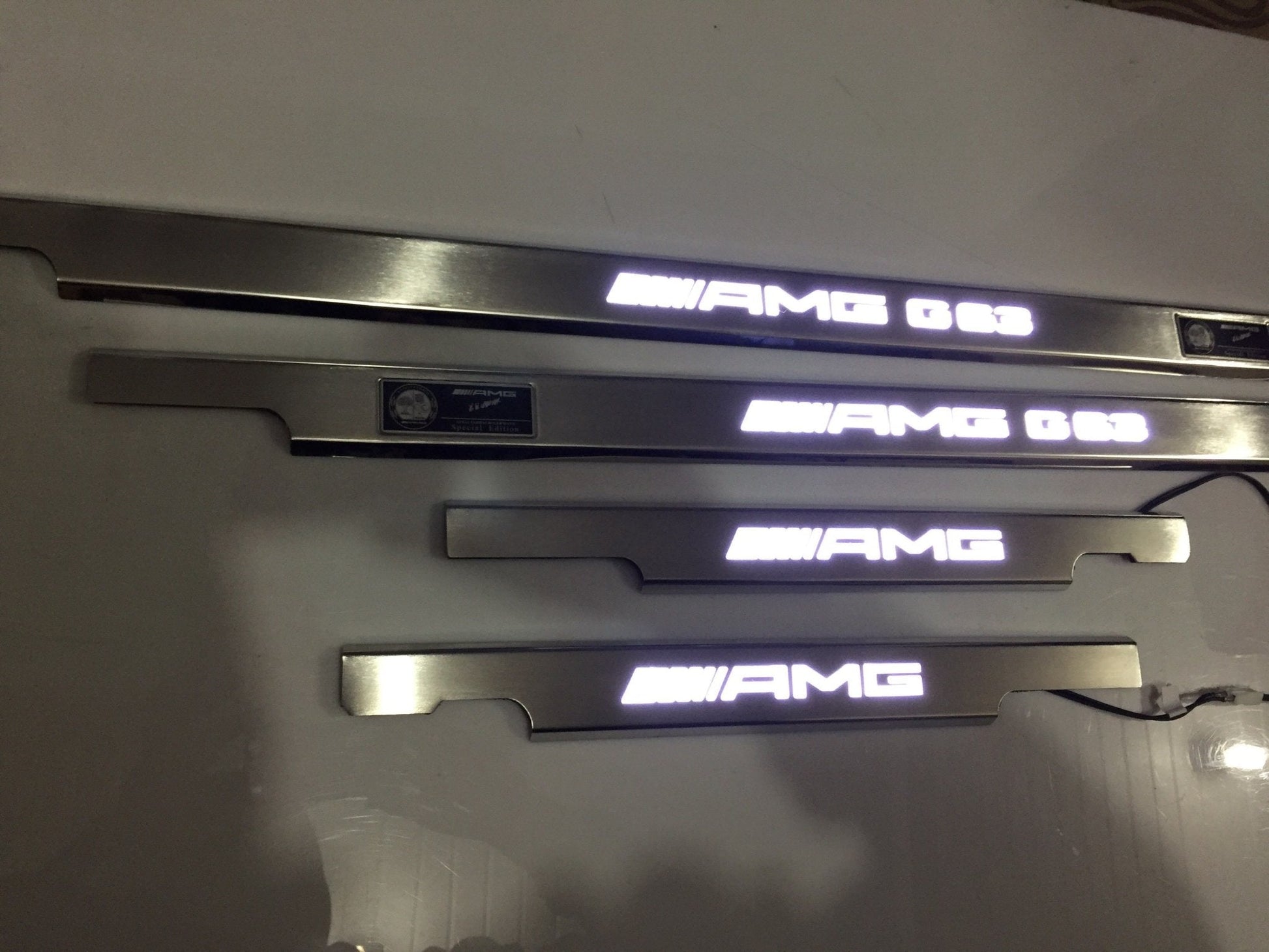 AMG G63 LED Illuminated Door Sills 4 or 5 pcs for Mercedes-Benz G-Class W463 from Tuning Shop, crafted from stainless steel with LED illumination.