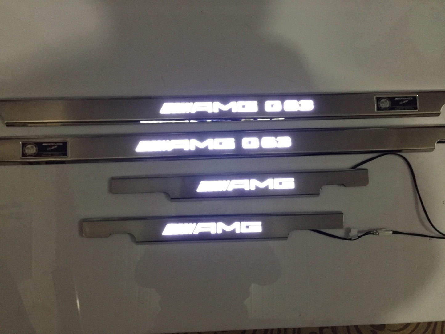 AMG G63 LED Illuminated Door Sills 4 or 5 pcs for Mercedes-Benz G-Class W463 from Tuning Shop, crafted from stainless steel with LED illumination.