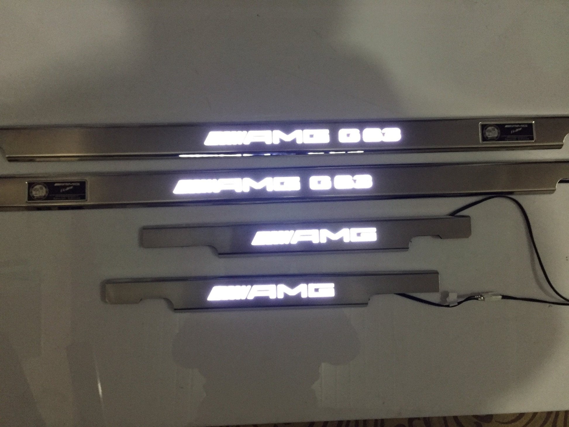 AMG G63 LED Illuminated Door Sills 4 or 5 pcs for Mercedes-Benz G-Class W463 from Tuning Shop, crafted from stainless steel with LED illumination.