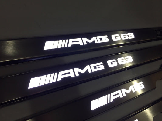 AMG G63 LED Illuminated Door Sills 4 or 5 pcs for Mercedes-Benz G-Class W463 from Tuning Shop, crafted from stainless steel with LED illumination.