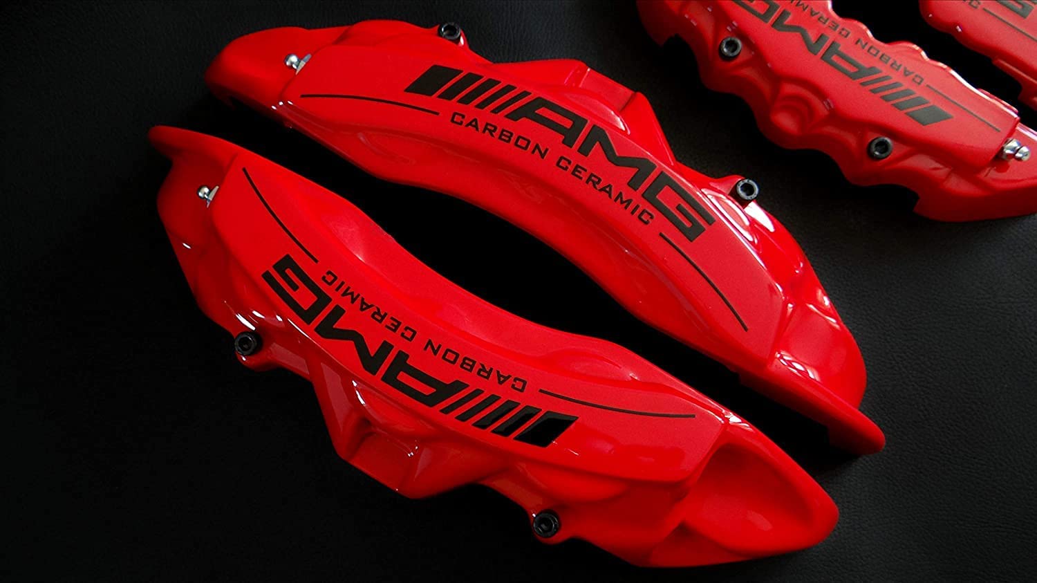 AMG Red Disc Caliper Covers with Carbon Ceramic Sign, 4 pcs set for Mercedes-Benz G-Wagon W463 from Tuning Shop, made of fiberglass reinforced plastic.
