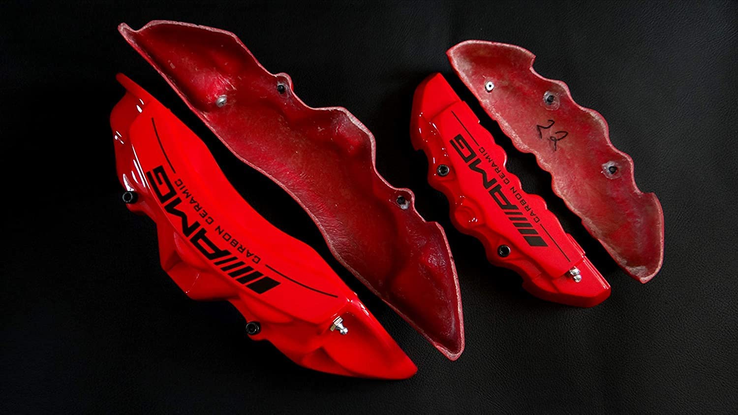 AMG Red Disc Caliper Covers with Carbon Ceramic Sign, 4 pcs set for Mercedes-Benz G-Wagon W463 from Tuning Shop, made of fiberglass reinforced plastic.