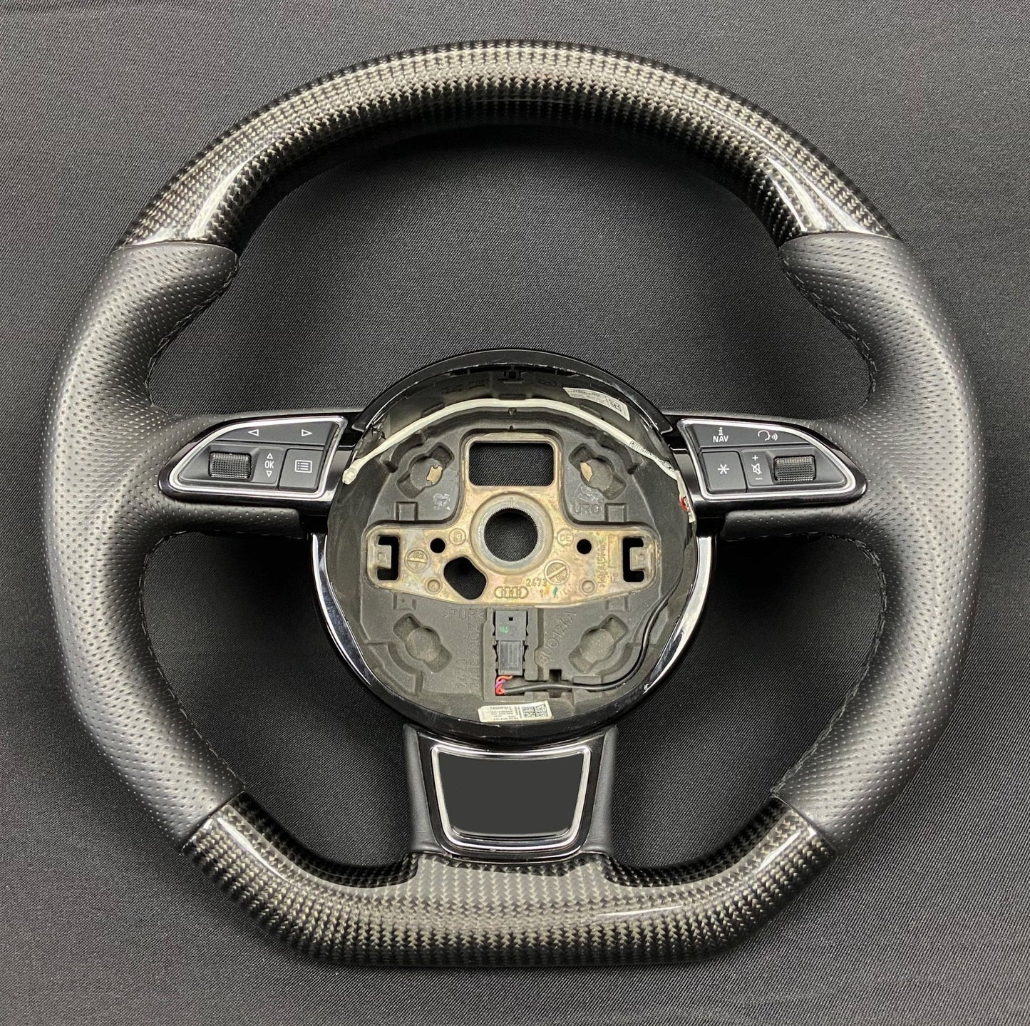 OEM remanufactured Audi A6 A7 A8 steering wheel with carbon fiber, perforated black leather, flat bottom, and stock paddle shifts from Tuning Shop.