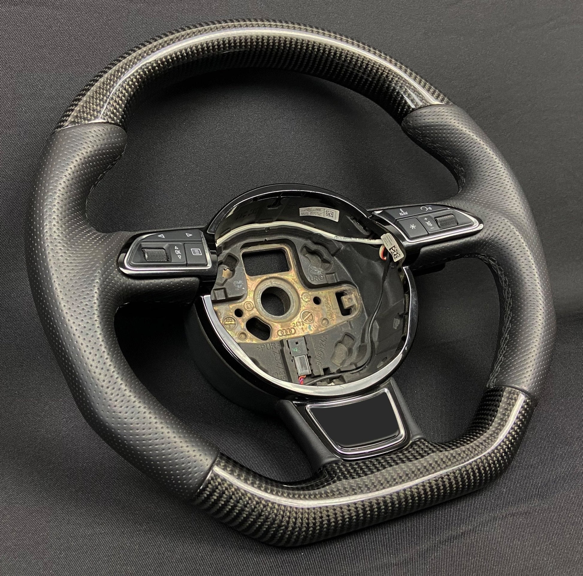 OEM remanufactured Audi A6 A7 A8 steering wheel with carbon fiber, perforated black leather, flat bottom, and stock paddle shifts from Tuning Shop.