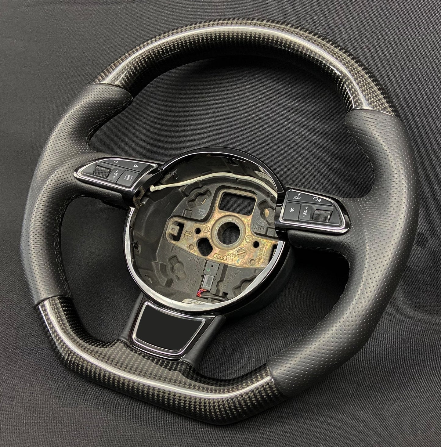 OEM remanufactured Audi A6 A7 A8 steering wheel with carbon fiber, perforated black leather, flat bottom, and stock paddle shifts from Tuning Shop.