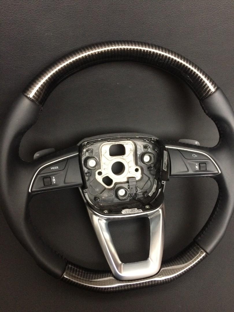 OEM remanufactured Audi Q7 steering wheel with carbon fiber, black leather, flat bottom, and stock paddle shifts from Tuning Shop.