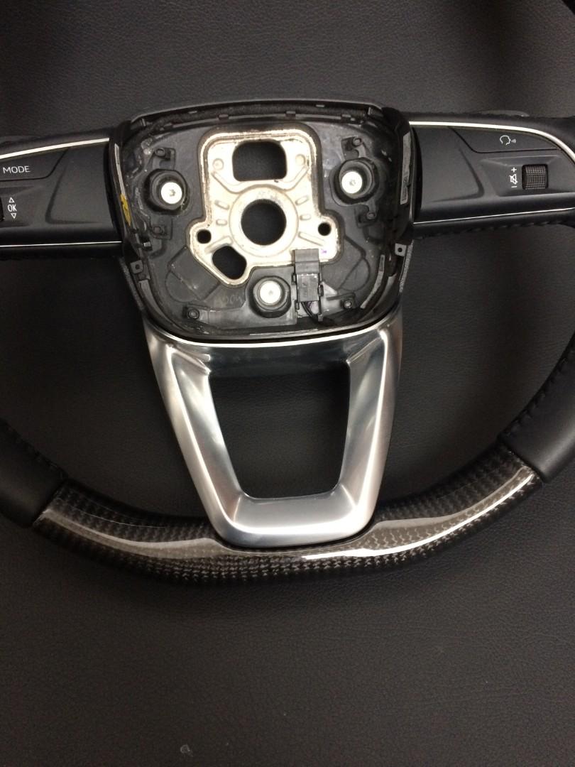 OEM remanufactured Audi Q7 steering wheel with carbon fiber, black leather, flat bottom, and stock paddle shifts from Tuning Shop.