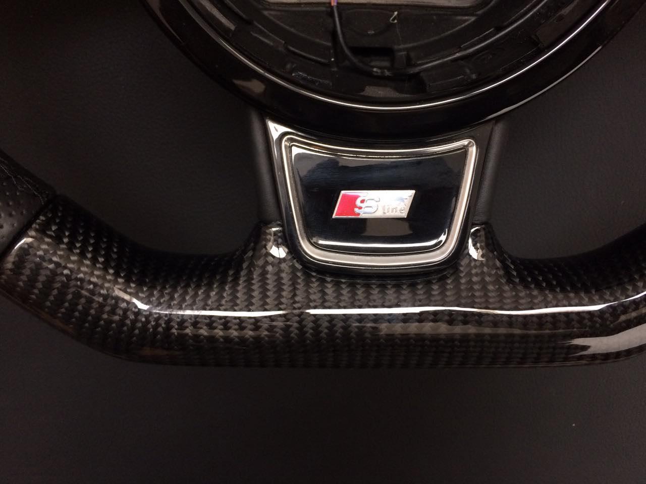 OEM remanufactured Audi RS6 RS4 RS5 RS7 SQ5 S4 S5 steering wheel with carbon fiber and perforated black leather from Tuning Shop.