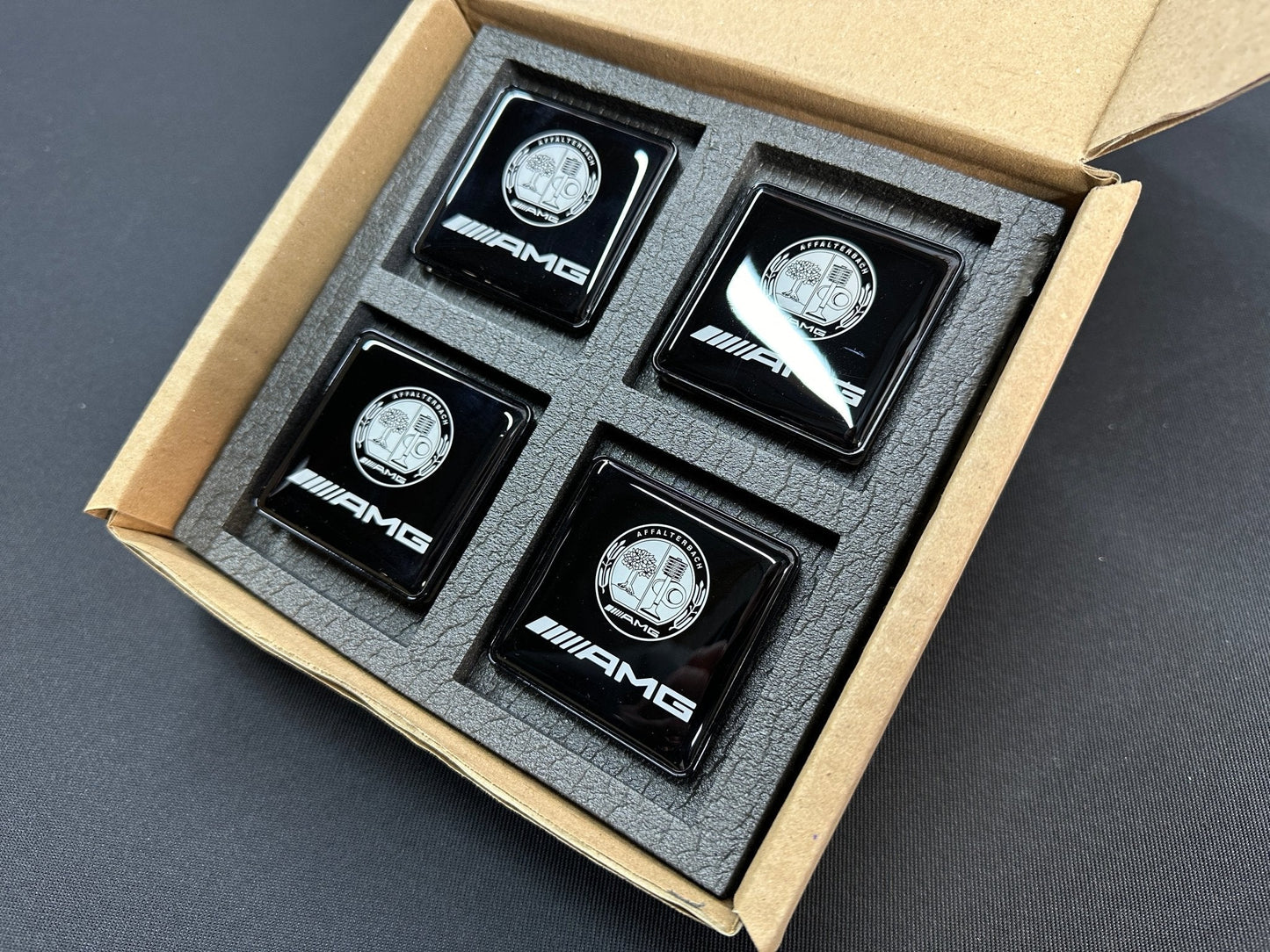 Seats Emblem set in black color with AMG Affalterbach logo for Mercedes-Benz