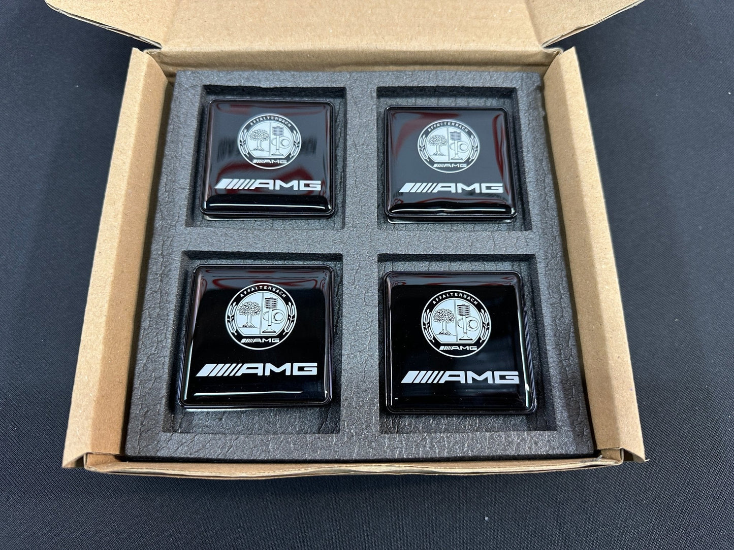 Seats Emblem set in black color with AMG Affalterbach logo for Mercedes-Benz