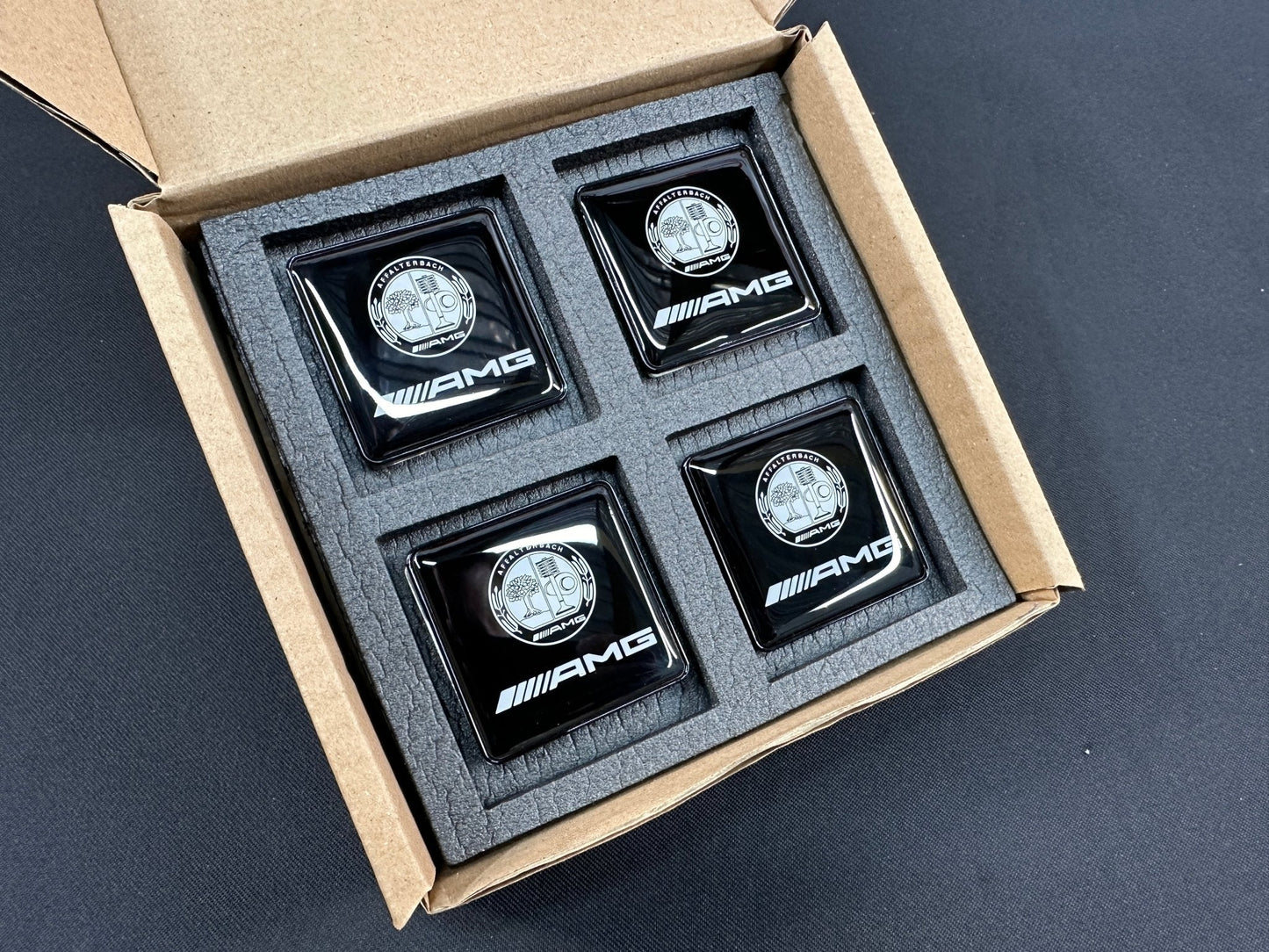 Seats Emblem set in black color with AMG Affalterbach logo for Mercedes-Benz