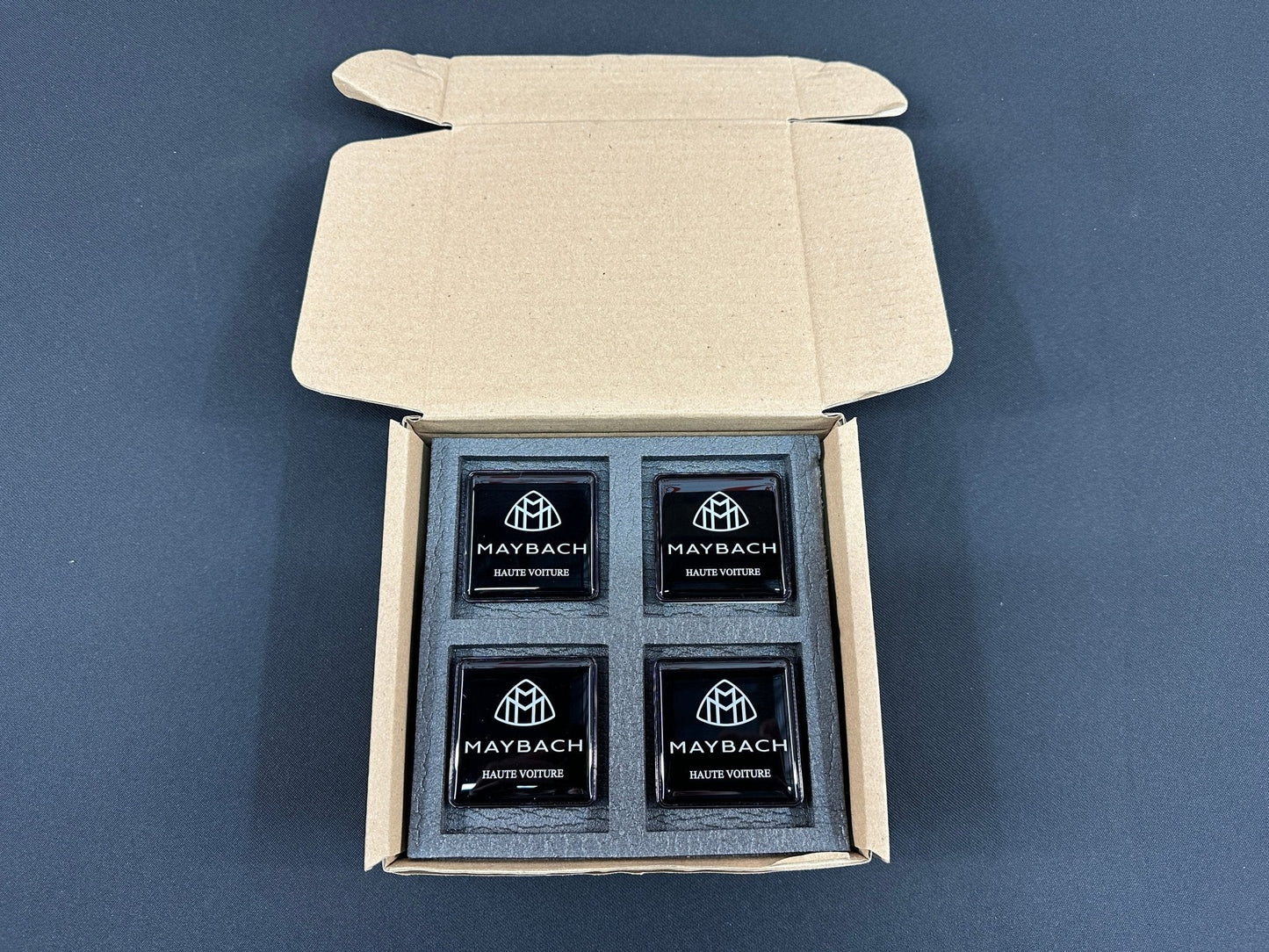 Seats Emblem set in black color with Maybach Haute Voiture logo for Mercedes-Benz