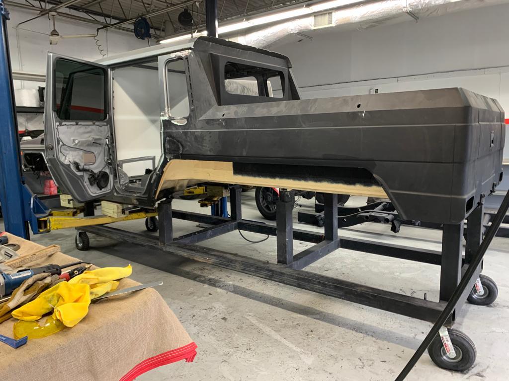 Stainless steel rear pickup body kit for conversion of regular G-Class W463 to 6x6 from Tuning Shop, includes body, glass, seals, rear door, yacht wood flooring, and body arch.